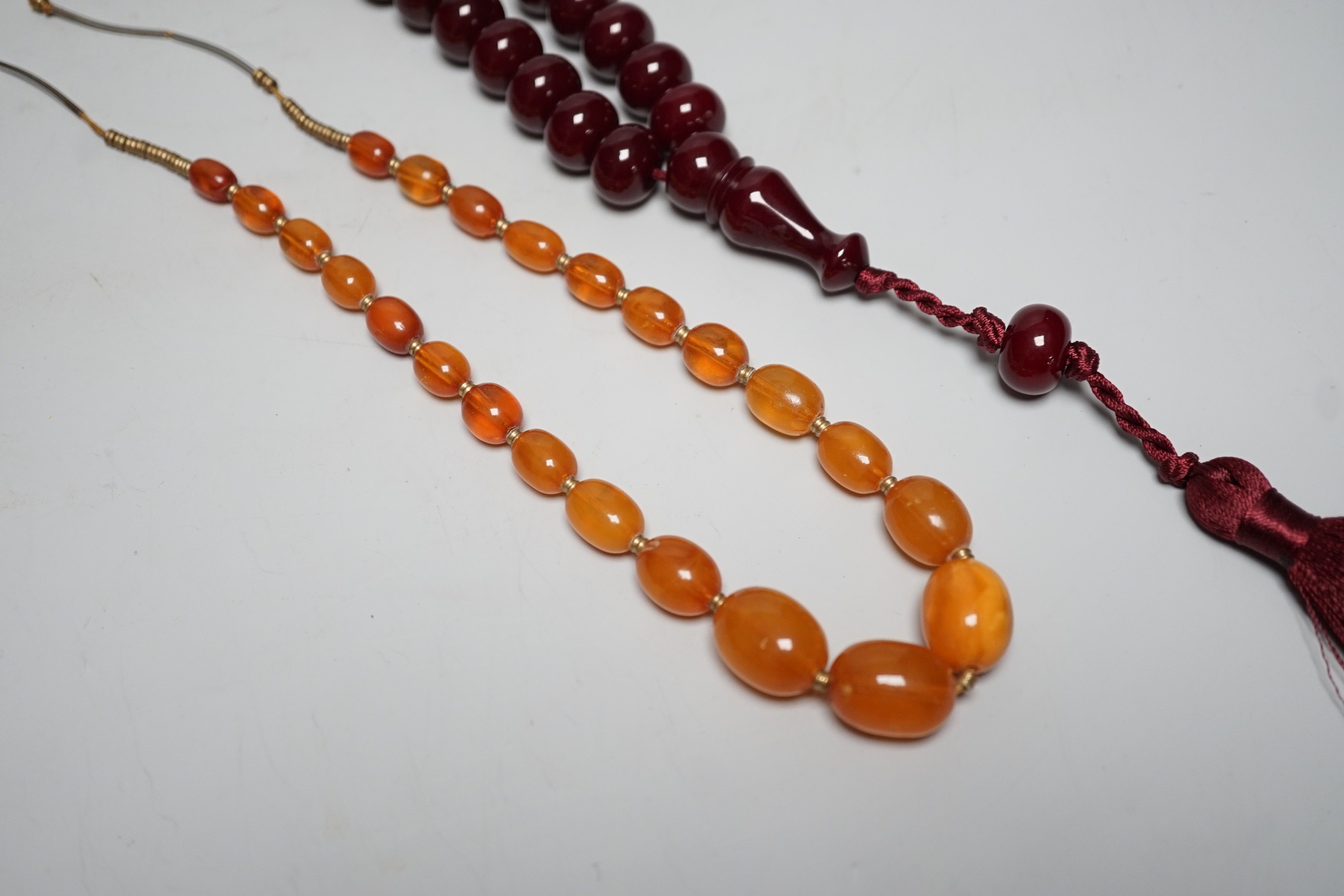 A Chinese amber and cherry amber type necklace